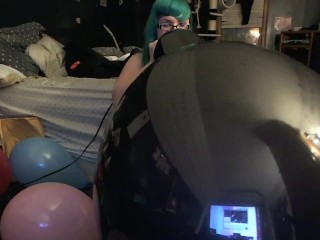 Chubby teen blowing and popping balloons