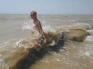 Swimming, splashing and posing naked in the sea...