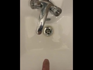 Extra small penis pissing in a sink with no hands being very high (compare)