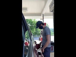 dude with a hot cock, exhibit's himself while pumping gas.