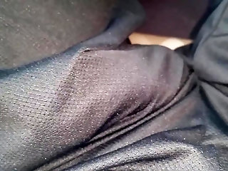shaking bulge of black shorts on bus