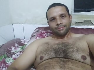 Young bear shows his body and masturbates while lying on his bed 1