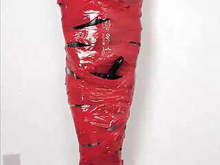 NANA Mummified with red plastic tape and then played with for orgasms