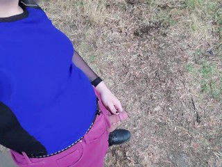 Tgirl takes a piss out in the open