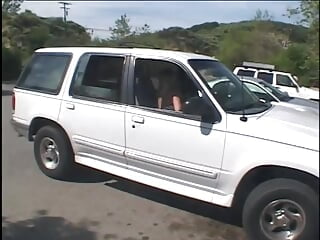 Guy pulls over and fondles blonde, getting her to suck his cock