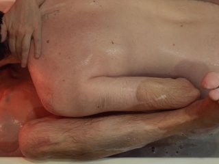 Two hairy guys caress each other in a bubble bath, do feet massage, piss and cum from handjob